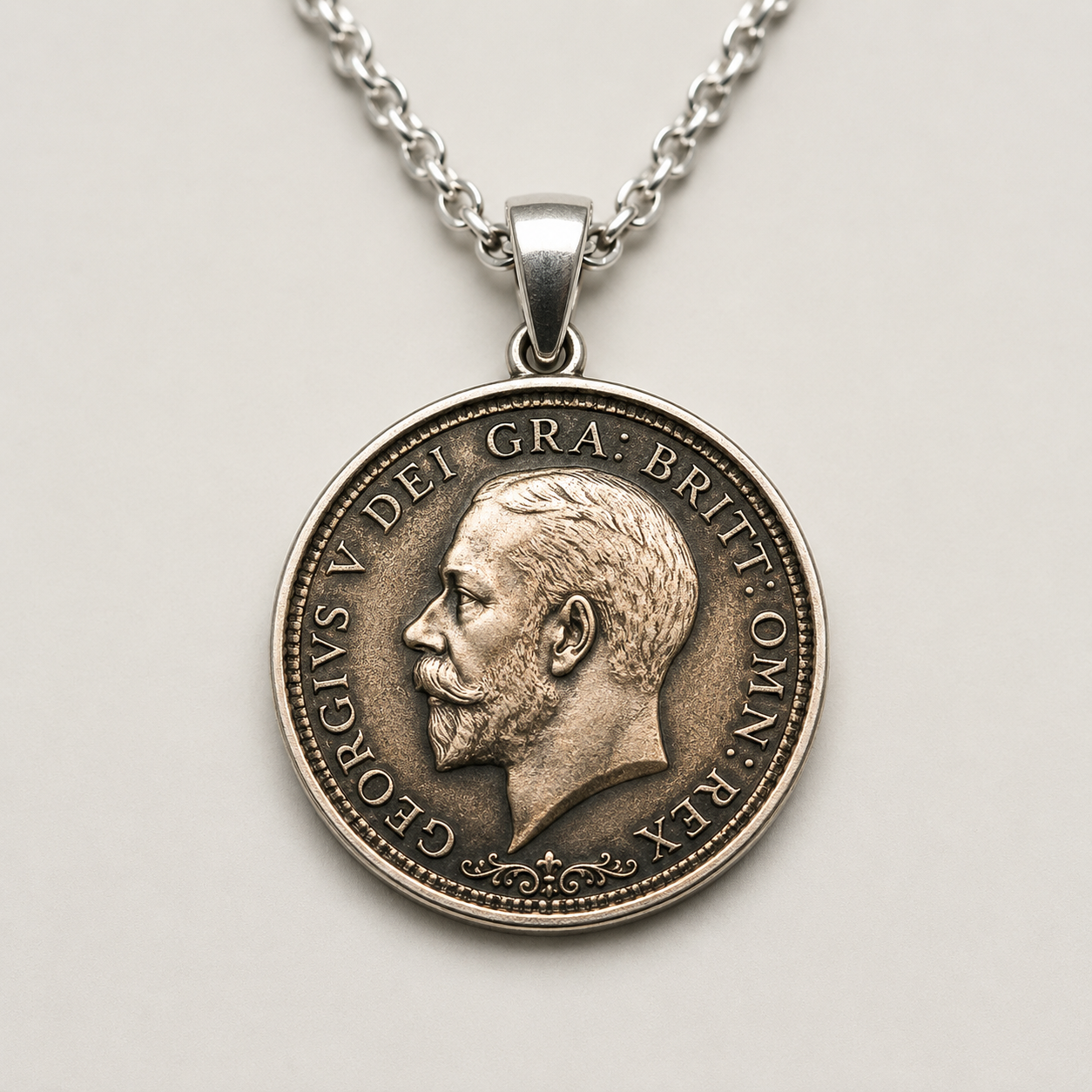 Coin-inspired pendant with engraved detailing